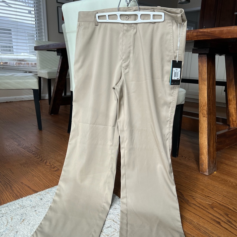 Nike Golf men’s pants, size 34x32. New with tags. Dri-Fit khaki color.
